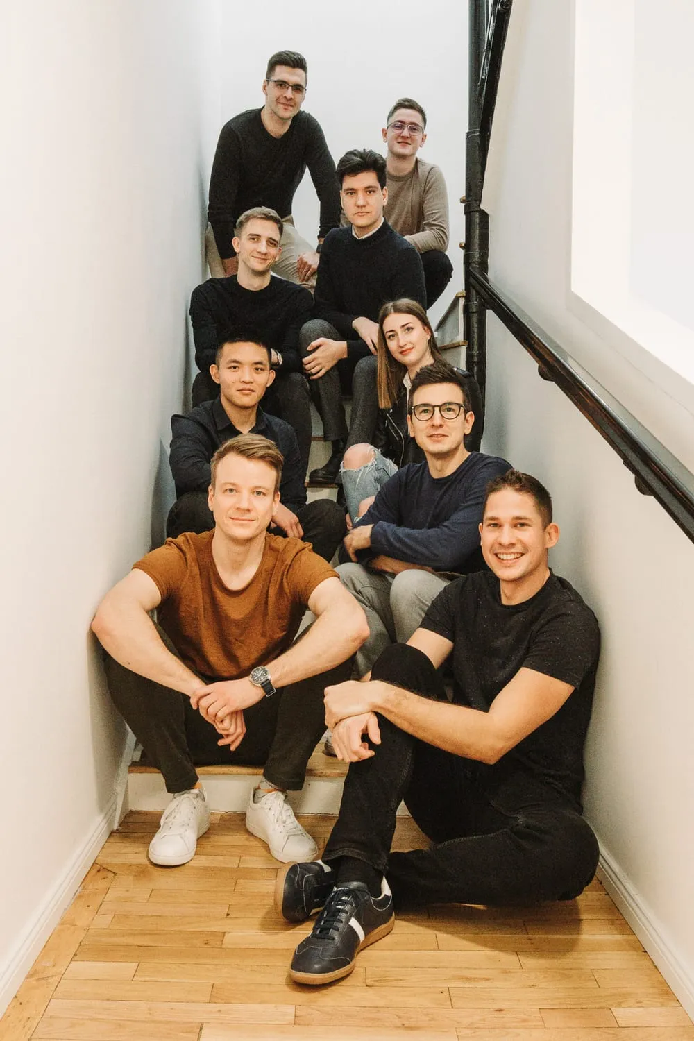 The Enlight Digital Studio team of nine on the office stairs