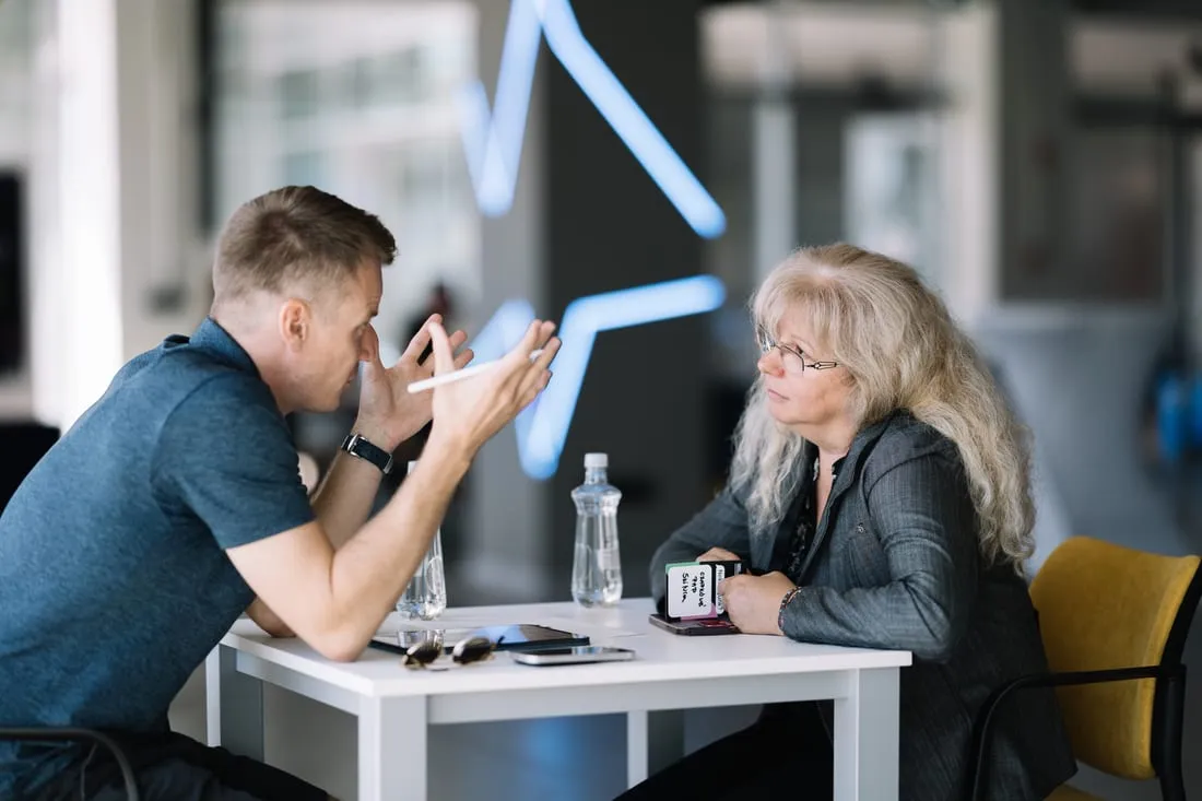 Peter working through a product decision with a founder across a table